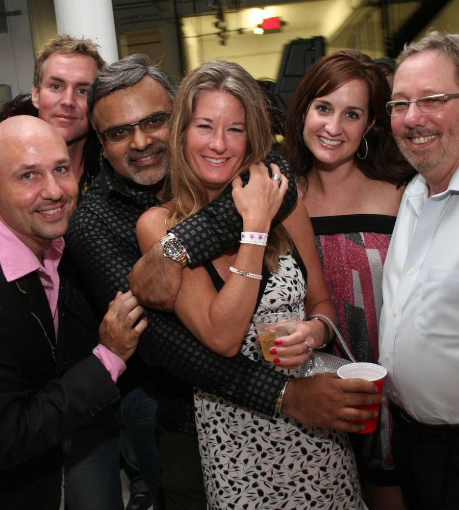 Neighbors embracing at a community gathering